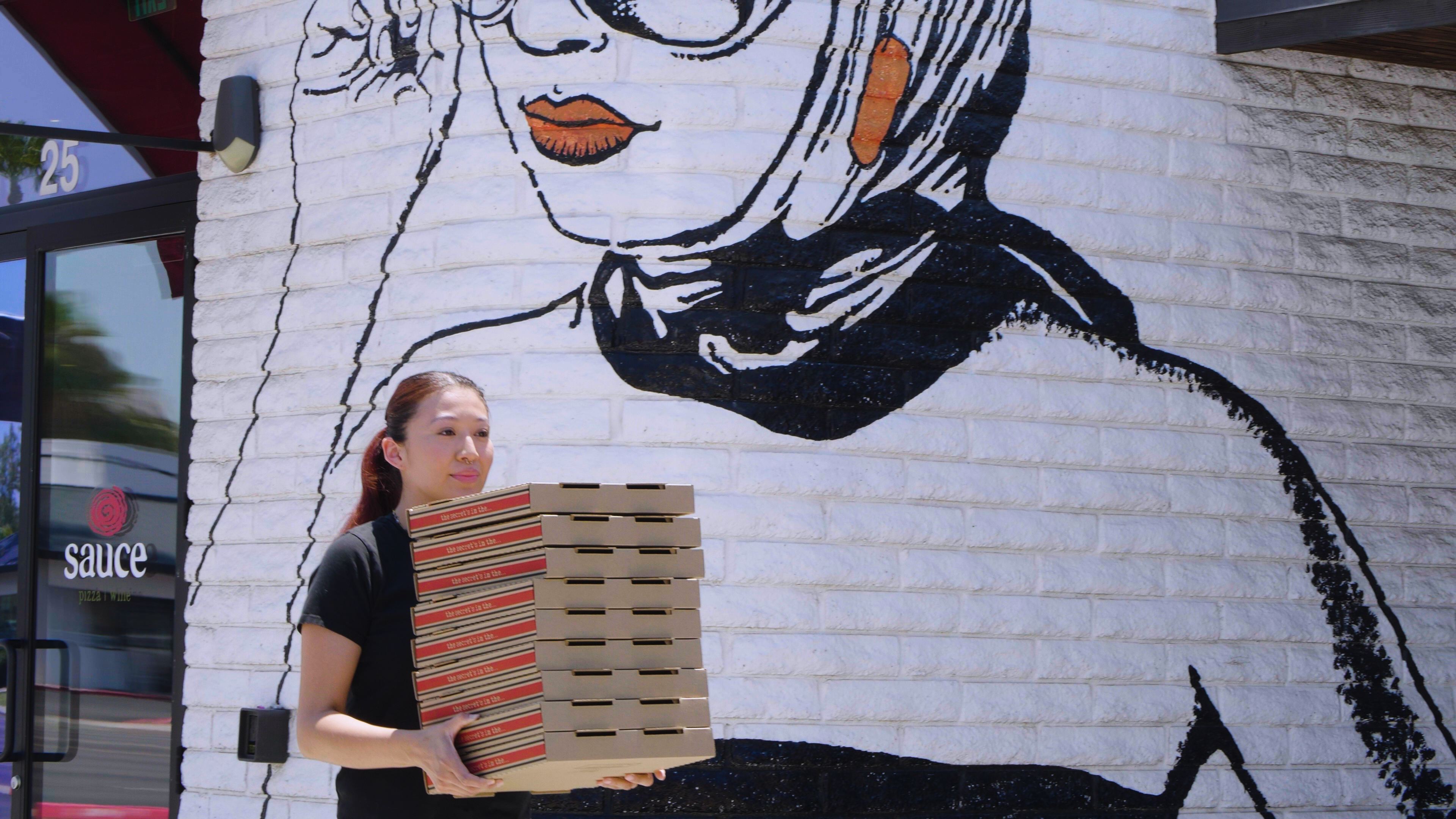 franchise training and support girl carrying boxes